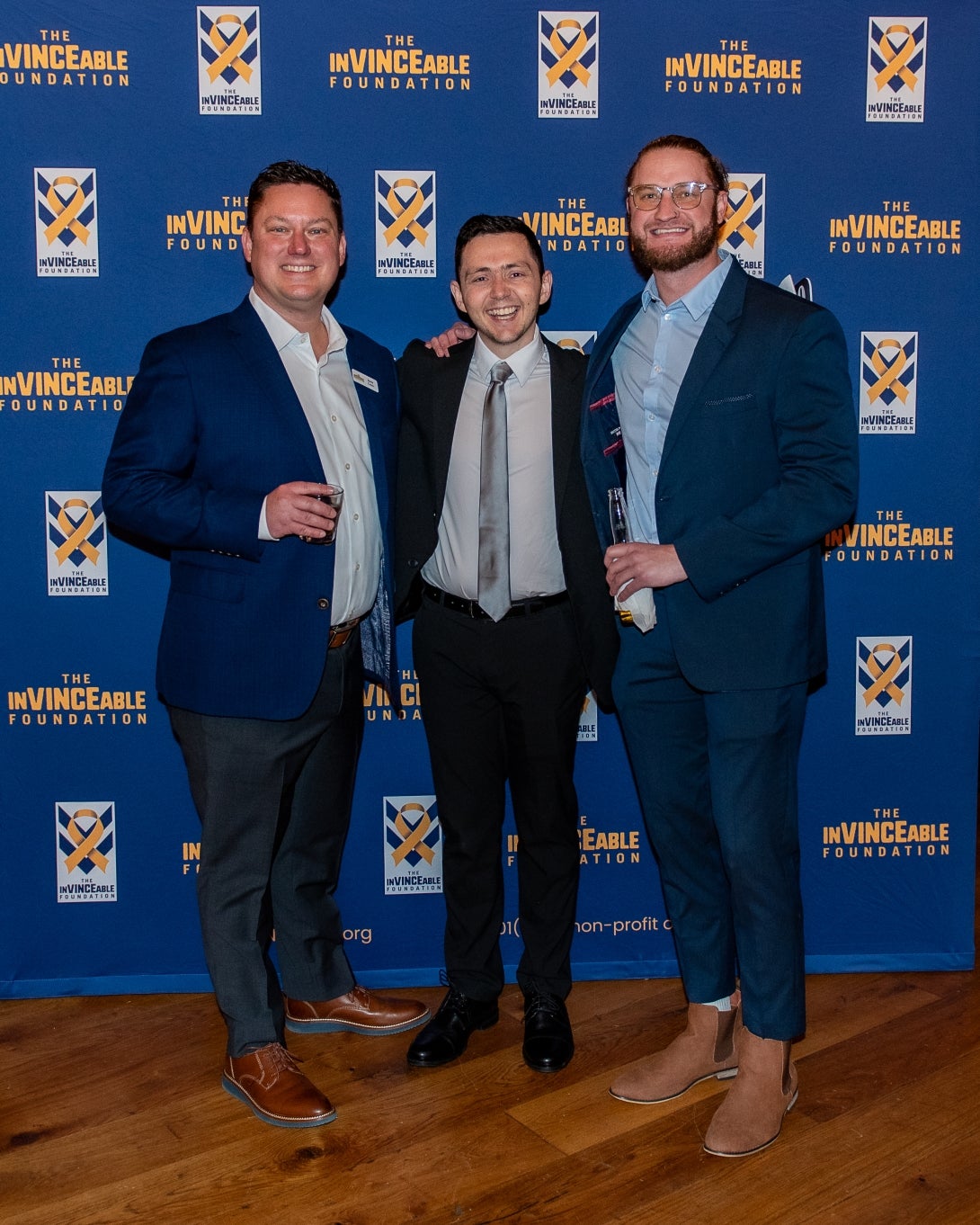 Event speaker Brady Lucas (center) poses with fellow board member and MI Windows and Doors Sales Leader Jason Cecco (left) and event supporter Kevin Rice (right) at the InVINCEable Foundation’s Inaugural Gala.